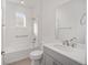 Bathroom with a bathtub, toilet, vanity with quartz countertop at 10330 Sw 99Th Ln, Ocala, FL 34481
