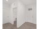 Bright entryway with wood-look tile flooring and access to laundry and other rooms at 10330 Sw 99Th Ln, Ocala, FL 34481