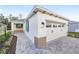 New home exterior boasts a two-car garage and attractive landscaping at 10330 Sw 99Th Ln, Ocala, FL 34481