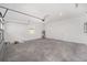Large garage with concrete floor and ample storage at 10330 Sw 99Th Ln, Ocala, FL 34481