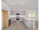 Modern kitchen featuring gray cabinets, quartz countertops, and stainless steel appliances at 10330 Sw 99Th Ln, Ocala, FL 34481