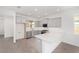 Modern kitchen with gray cabinets and white quartz countertops at 10330 Sw 99Th Ln, Ocala, FL 34481