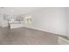 Open concept living room and kitchen with wood-look tile flooring at 10330 Sw 99Th Ln, Ocala, FL 34481