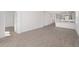 Open concept living area with wood-look tile flooring and access to other rooms at 10330 Sw 99Th Ln, Ocala, FL 34481