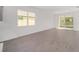 Open concept living room with kitchen view and patio access at 10330 Sw 99Th Ln, Ocala, FL 34481
