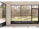 Peaceful screened porch overlooking backyard at 10330 Sw 99Th Ln, Ocala, FL 34481