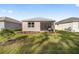 Home with screened porch and grassy backyard at 10338 Sw 99Th Ln, Ocala, FL 34481