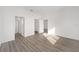 Spacious bedroom with hardwood floors and en-suite bathroom at 10338 Sw 99Th Ln, Ocala, FL 34481