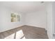Bright bedroom with hardwood floors and large window at 10338 Sw 99Th Ln, Ocala, FL 34481
