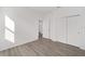 Bright bedroom with hardwood floors and double doors to closet at 10338 Sw 99Th Ln, Ocala, FL 34481