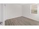 Simple bedroom with hardwood floors and window at 10338 Sw 99Th Ln, Ocala, FL 34481