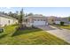 New construction home with two-car garage and landscaped yard at 10338 Sw 99Th Ln, Ocala, FL 34481