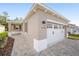New construction home with two-car garage and paver walkway at 10338 Sw 99Th Ln, Ocala, FL 34481
