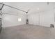 Garage with concrete floor and automatic door opener at 10338 Sw 99Th Ln, Ocala, FL 34481