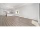 Open concept living room and kitchen with wood floors at 10338 Sw 99Th Ln, Ocala, FL 34481