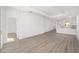Open living room with wood-look floors and kitchen views at 10338 Sw 99Th Ln, Ocala, FL 34481