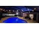 Night view of a screened pool and patio at 12887 Sw 31St Avenue Rd, Ocala, FL 34473