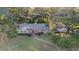 Ranch home with large backyard, mature trees, and stone pathway at 1416 Se 17Th Ave, Ocala, FL 34471