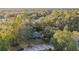 House nestled in a wooded area, with a large yard and street view at 1416 Se 17Th Ave, Ocala, FL 34471