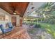 Extended covered patio featuring seating area and a view of the backyard at 1416 Se 17Th Ave, Ocala, FL 34471