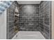 Bathroom with dark tile, a shower/tub combo and gold fixtures at 1416 Se 17Th Ave, Ocala, FL 34471