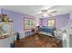 Charming bedroom with purple walls and hardwood floors at 1416 Se 17Th Ave, Ocala, FL 34471