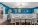 Bright dining room with white table, blue walls, and hardwood floors at 1416 Se 17Th Ave, Ocala, FL 34471