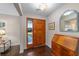 Hardwood floor entryway with wood door and vintage secretary at 1416 Se 17Th Ave, Ocala, FL 34471