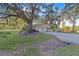 Two-car garage with driveway and landscaping at 1416 Se 17Th Ave, Ocala, FL 34471