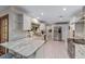 Modern kitchen with white shaker cabinets, granite countertops, and stainless steel appliances at 1416 Se 17Th Ave, Ocala, FL 34471