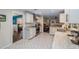 Modern kitchen with white cabinets, granite countertops, and stainless steel appliances at 1416 Se 17Th Ave, Ocala, FL 34471