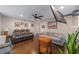 Bright living room with hardwood floors, comfy seating, and a view into the kitchen at 1416 Se 17Th Ave, Ocala, FL 34471