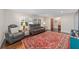 Living room with hardwood floors, comfortable seating, and large windows at 1416 Se 17Th Ave, Ocala, FL 34471