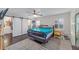 Main bedroom with a cozy bed, barn door closet, and hardwood floors at 1416 Se 17Th Ave, Ocala, FL 34471