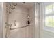 Updated shower with tile surround and a handheld shower head at 1416 Se 17Th Ave, Ocala, FL 34471