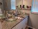 Double vanity bathroom with granite countertops and glass sinks at 17 Pecan Crse Dr, Ocala, FL 34472