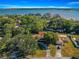 Aerial view of a house near a lake, showcasing its waterfront access at 21 Se Ocale Way, Summerfield, FL 34491