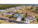 Aerial view showcasing a house in a golf course community near other homes at 2699 Nw 58Th Terrace, Ocala, FL 34482