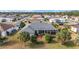 Aerial view showcasing a house with a screened enclosure and well-maintained lawn at 2699 Nw 58Th Terrace, Ocala, FL 34482