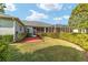 Backyard with screened patio and brick pavers at 2699 Nw 58Th Terrace, Ocala, FL 34482