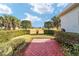 Landscaped backyard with red brick patio at 2699 Nw 58Th Terrace, Ocala, FL 34482