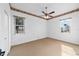 Spacious bedroom with two windows and carpet floors at 2699 Nw 58Th Terrace, Ocala, FL 34482