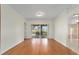 Bright dining room with hardwood floors and sliding glass doors leading to a patio at 2699 Nw 58Th Terrace, Ocala, FL 34482