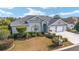 Single-story house with three-car garage and manicured lawn at 2699 Nw 58Th Terrace, Ocala, FL 34482