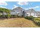 Single story house with three-car garage and lush landscaping at 2699 Nw 58Th Terrace, Ocala, FL 34482