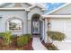 Attractive front entry with arched doorway and decorative glass at 2699 Nw 58Th Terrace, Ocala, FL 34482