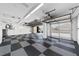 Garage with checkered floor and automatic door opener at 2699 Nw 58Th Terrace, Ocala, FL 34482