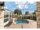 Screened-in hot tub with surrounding deck at 2699 Nw 58Th Terrace, Ocala, FL 34482