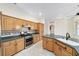 Kitchen with wood cabinets, granite countertops, and stainless steel appliances at 2699 Nw 58Th Terrace, Ocala, FL 34482