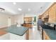 Kitchen with a large island, wood cabinets, and granite countertops at 2699 Nw 58Th Terrace, Ocala, FL 34482